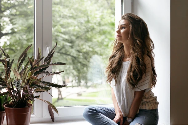 Young woman in a cafe reflecting